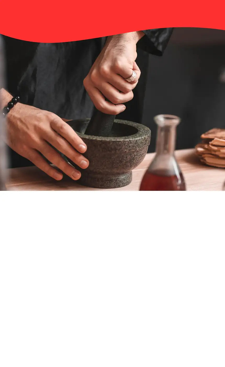 Hand grinding spices in pestle and mortar for Moxie story