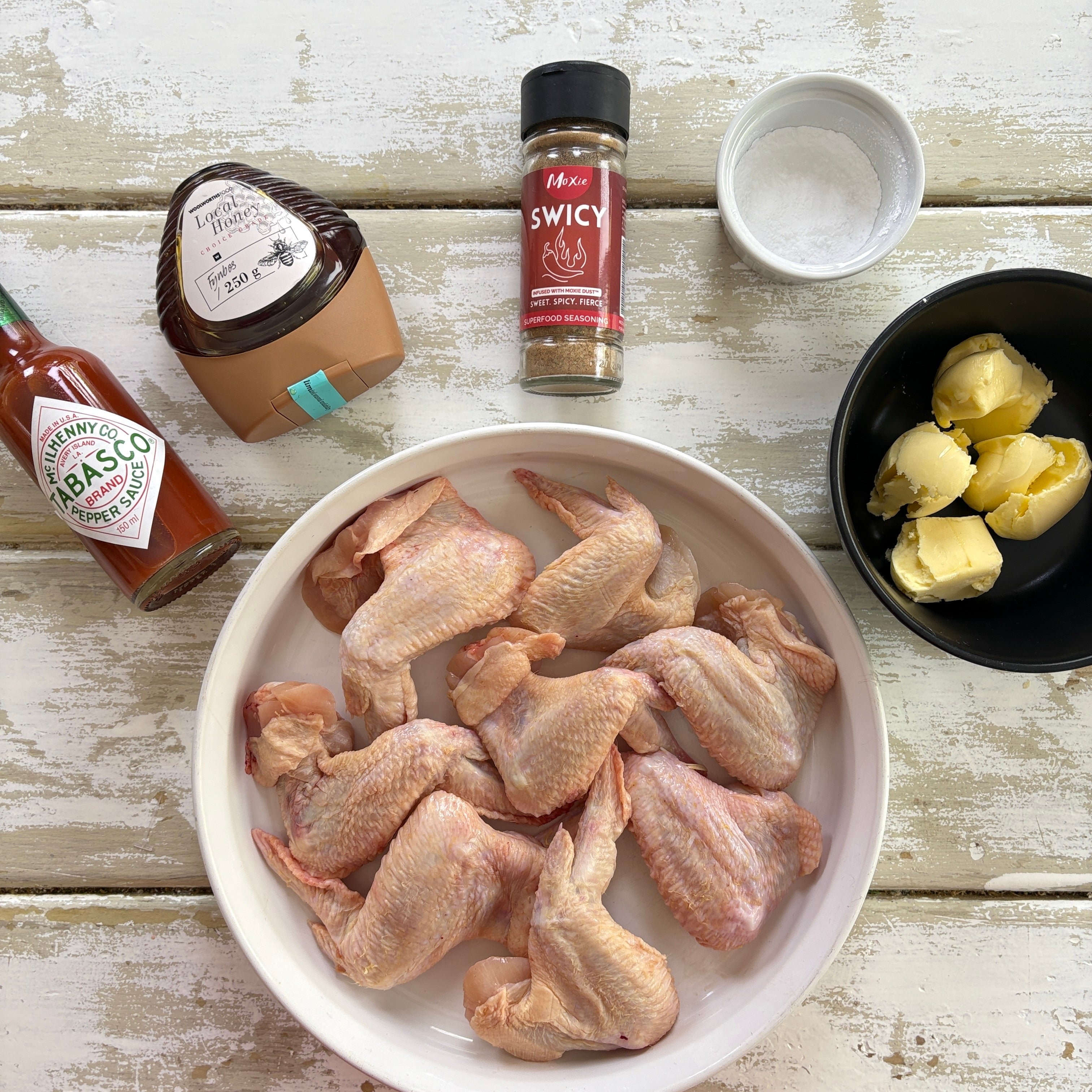 Ingredients for Swicy Buffalo Chicken Wings — chicken wings, butter, hot sauce, honey, and Moxie Swicy seasoning blend.
