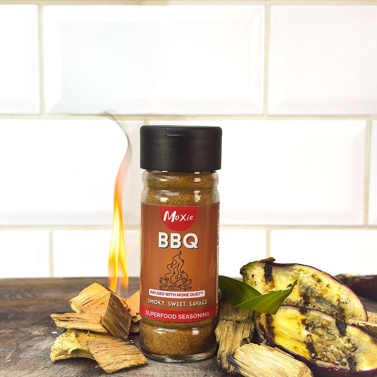 Moxie BBQ Superfood Seasoning bottle with fire and aubergine